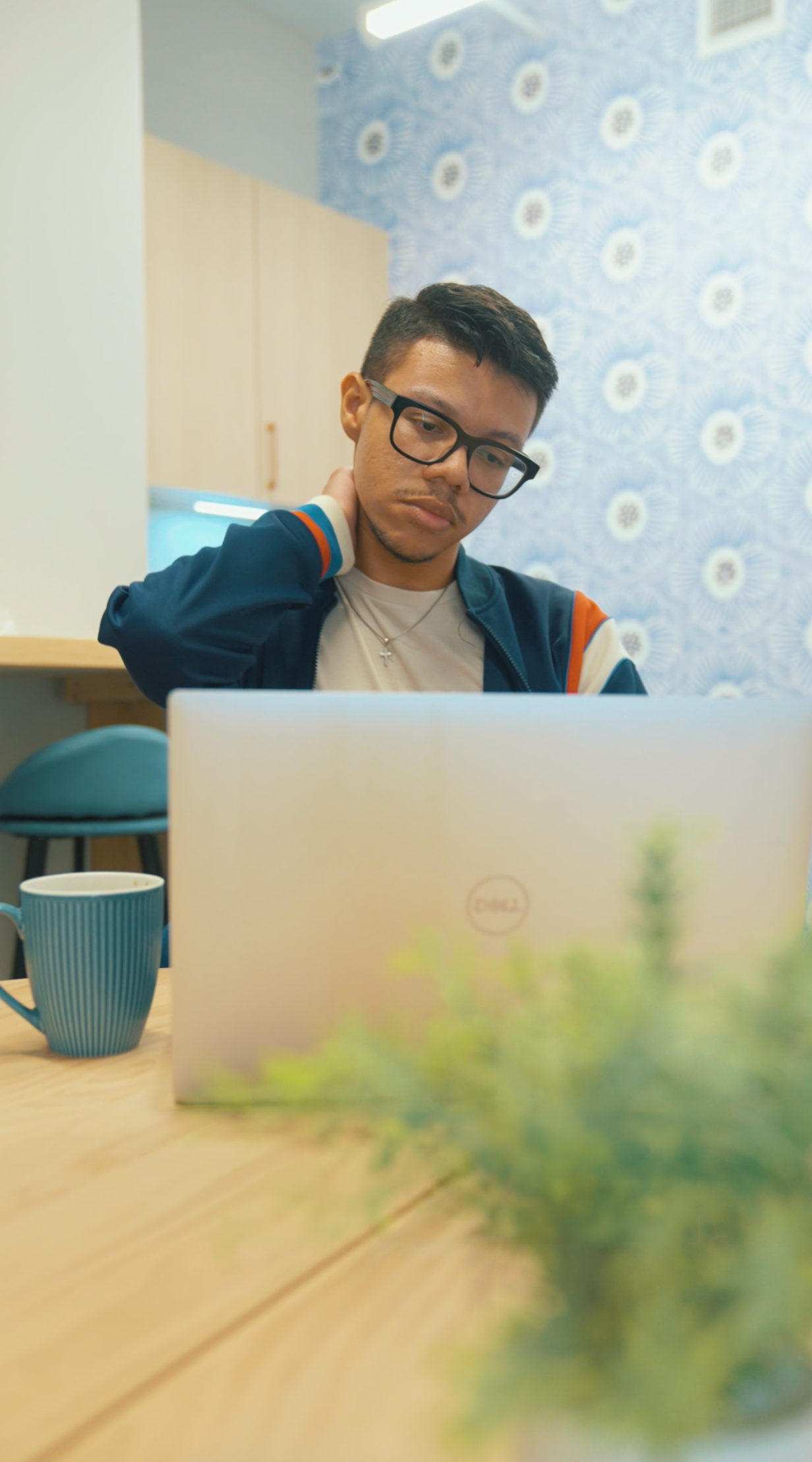 New Yorker considering care while working at a laptop